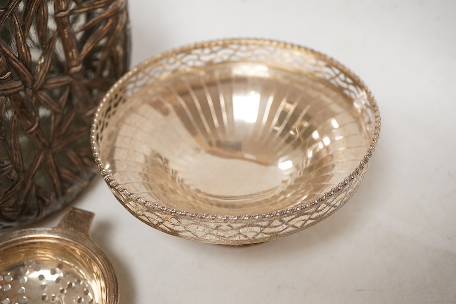 A Chinese sterling mounted dimpled glass decanter, with bamboo decoration, lacking stopper, approx. 19.5cm, together with a George V silver pedestal bonbon bowl, a pair of silver tea strainers by Roberts & Belk and a pai